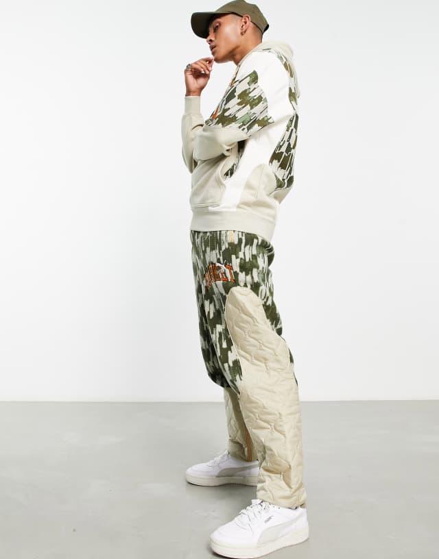 Puma x MARKET AOP relaxed sweatpants in off-white