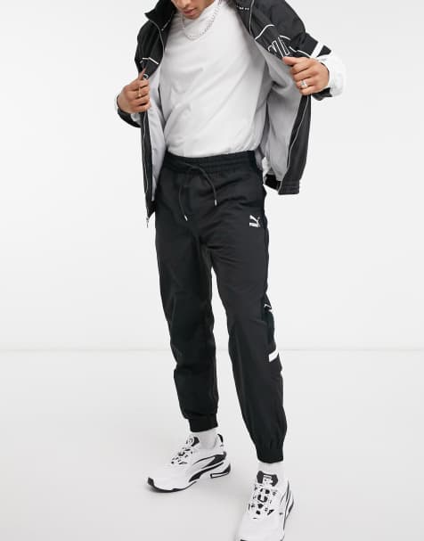 Puma XTG track pants in black - view 1