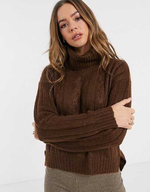QED London cable knit roll neck jumper in chocolate