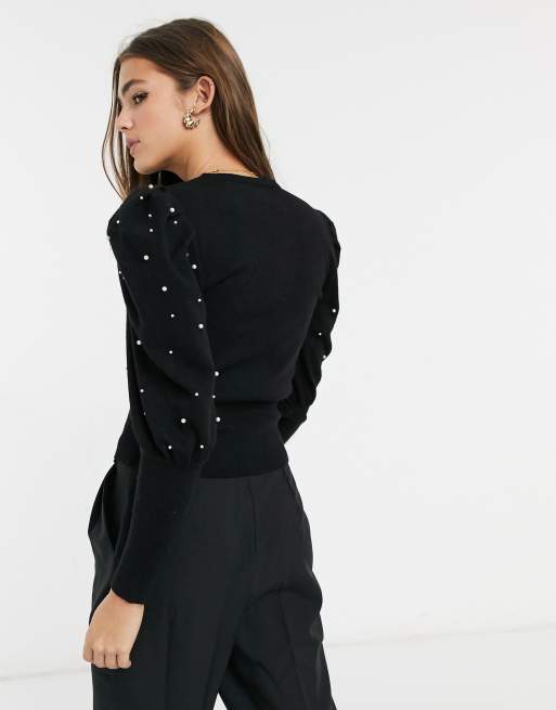 Black sweater with 2025 pearls on sleeves