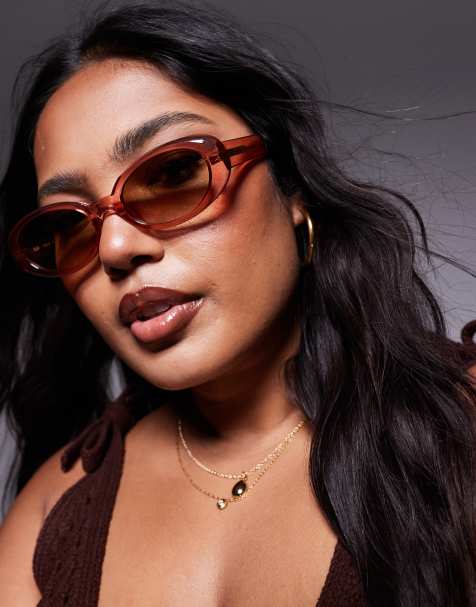 Quay – Felt Cute – Ovale, schmale Sonnenbrille in Rosa mit braunen Gläsern - view 1