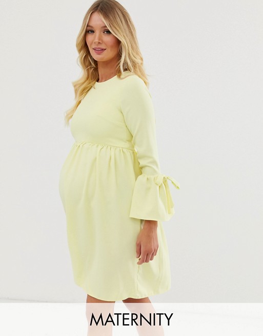Queen Bee Maternity skater dress with fluted sleeve in pastel yellow