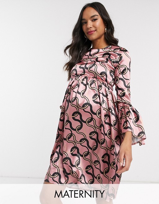 Queen Bee Maternity skater dress with fluted sleeve in pink chain print