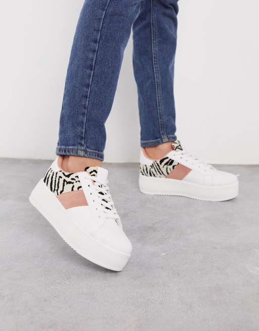 white sneakers with stripes