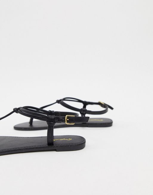 Qupid thong flat sandals in black