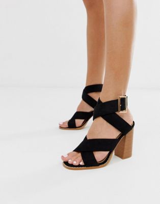 black stacked sandals