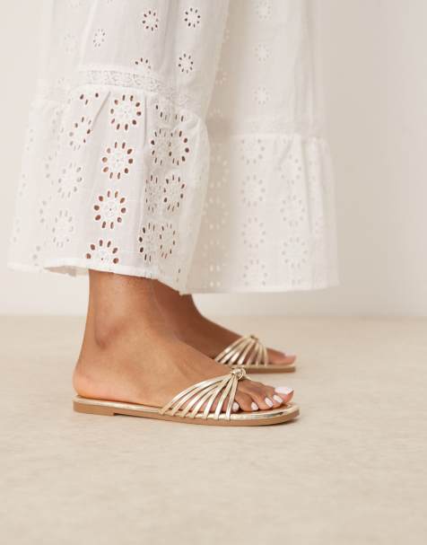 RAID - Bella - Platte sandalen met geknoopte bandjes in goud - view 1