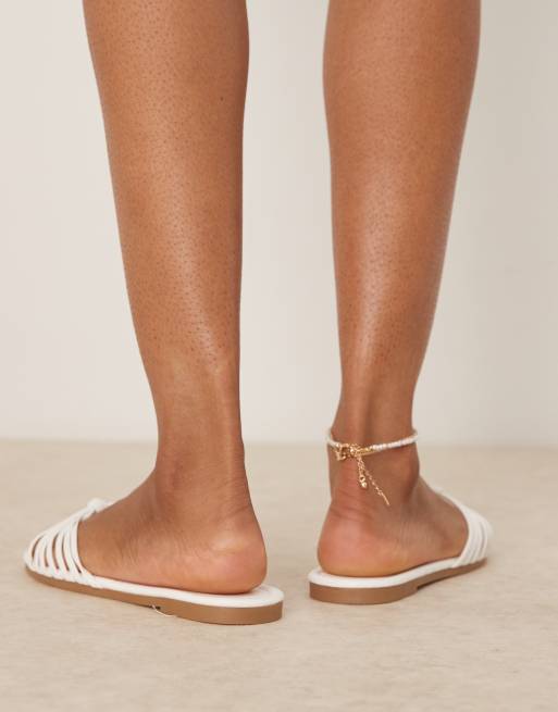RAID Bella strappy knot flat sandals in white