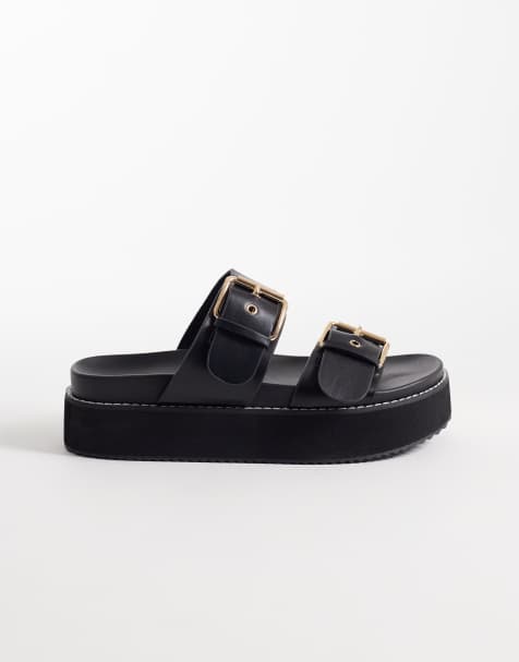 RAID – Dinnie – Svarta flatform-sandaler med spänne - view 1