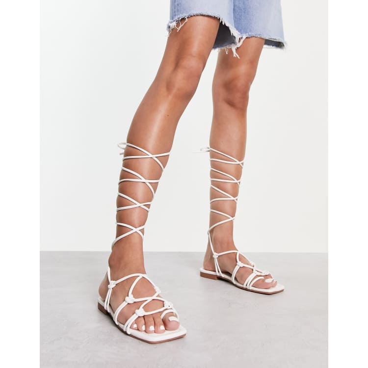 Thigh high lace cheap up flat sandals