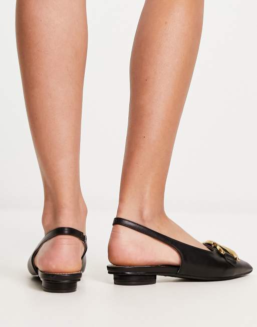 RAID flat shoes with gold buckle in black