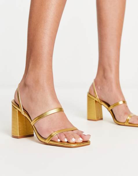 ASOS DESIGN Hitched bow detail mid block heeled sandals in gold