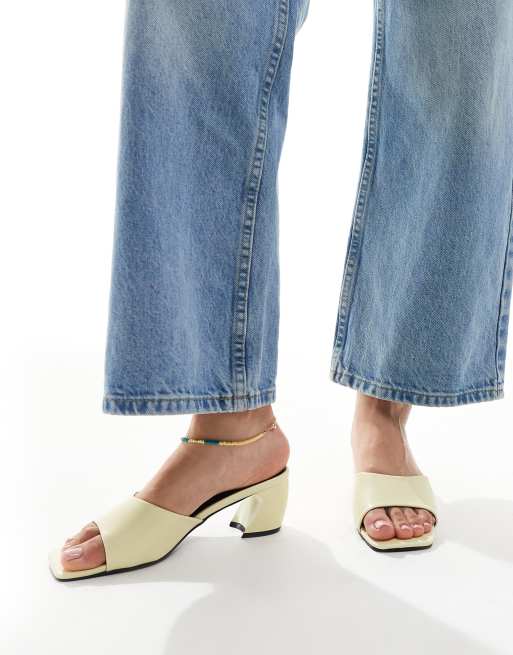 RAID Saanvi block heeled mules in butter yellow