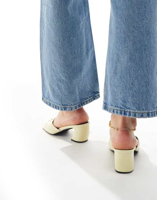 RAID Saanvi block heeled mules in butter yellow