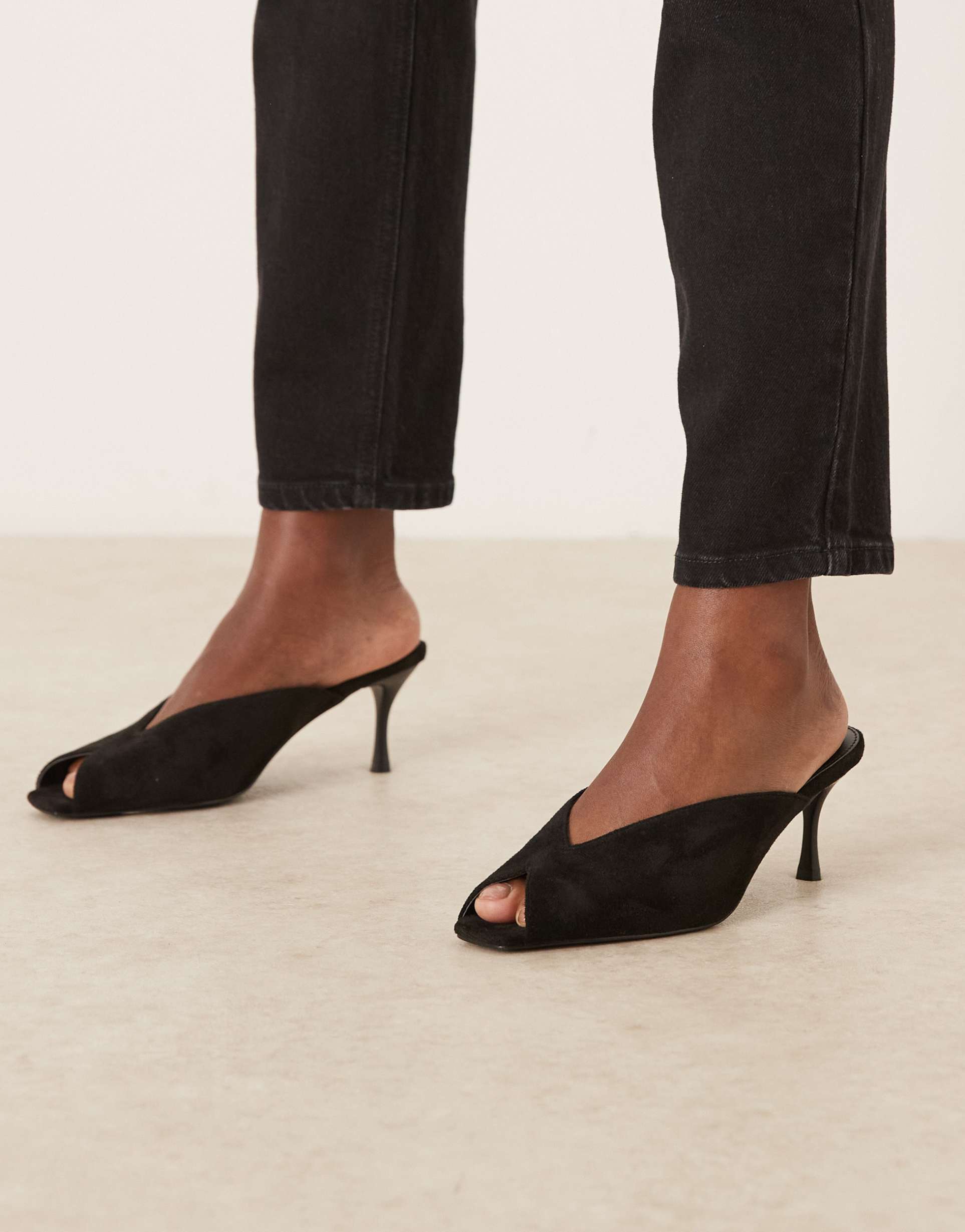 raid sonika kitten heel mules in black faux suedette