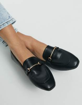 black shoes with gold trim