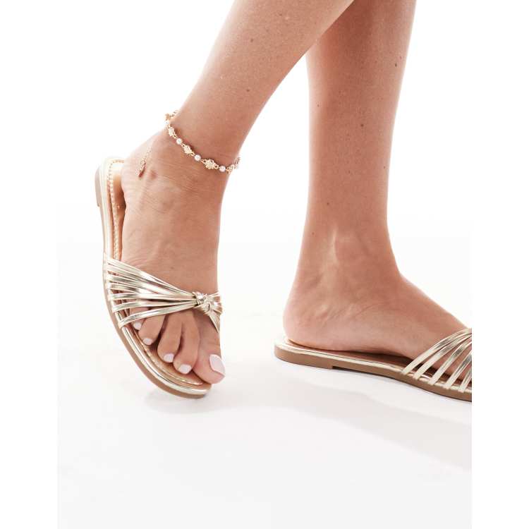 RAID Wide Fit Bella strappy knot flat sandals in gold ASOS