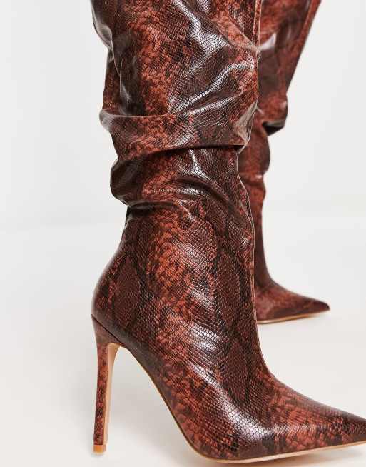 Raid Brayden stiletto knee boots in tan snake print