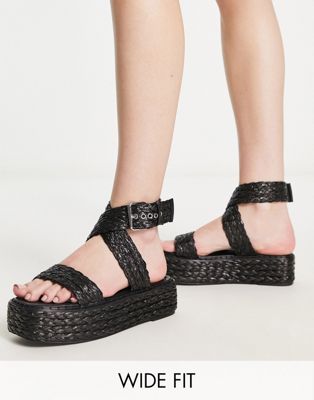 Crystal flatform sandals in black raffia