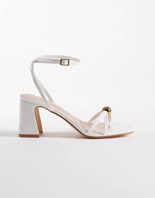 RAID Wide Fit Devena block heeled sandals in gold detail in white