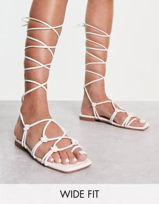 RAID Wide Fit Exclusive strappy ghillie tie sandals in off white