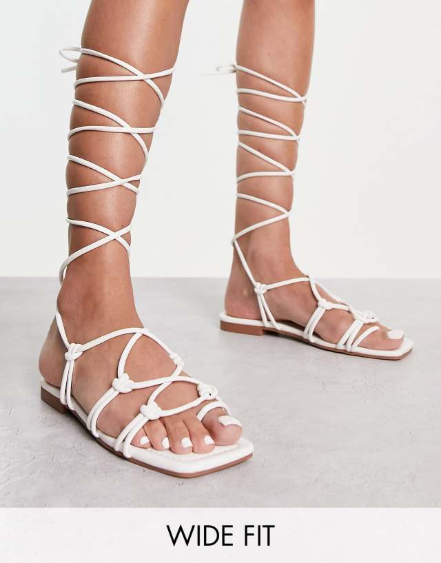 Raid Wide Fit Exclusive strappy ghillie tie sandals in off white