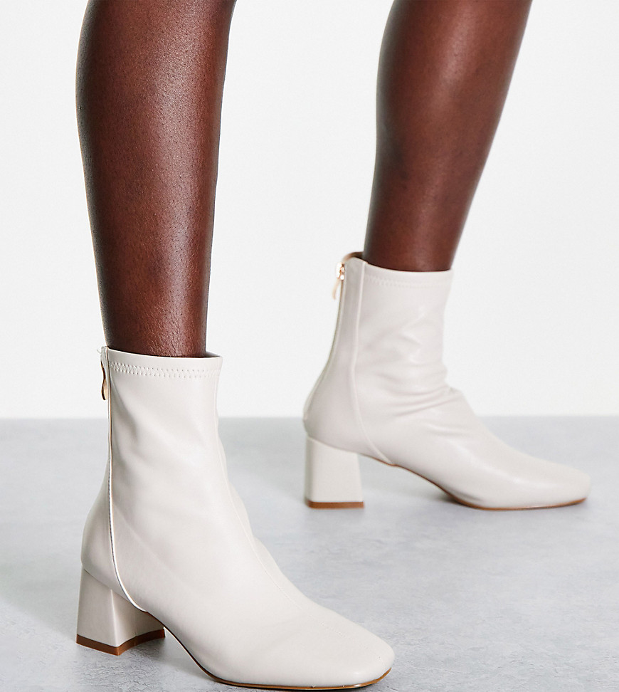 RAID Wide Fit Maddy mid heel sock boots in cream-White