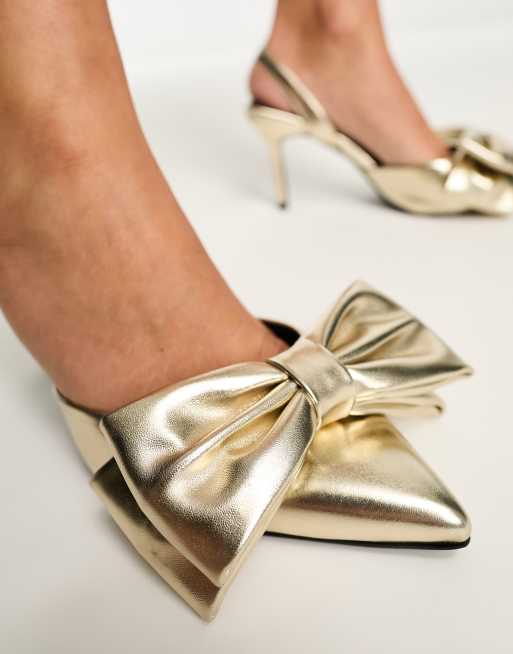 RAID Wide Fit Martini pointed heeled shoe with bow in metallic gold