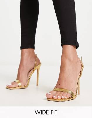 RAID Wide Fit - Meryn - Sandali a pianta larga con tacco color oro coccodrillo