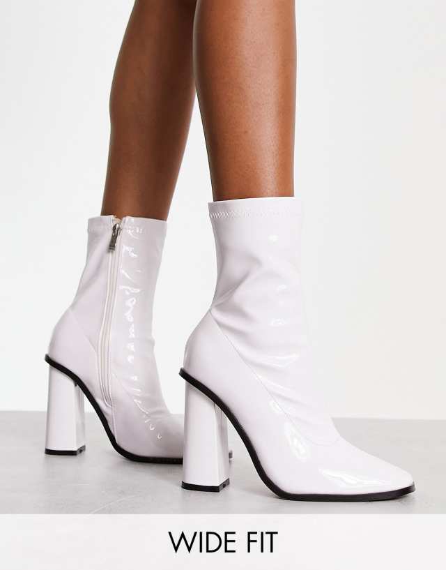 Raid Wide Fit Saylor block heel sock boots in white patent