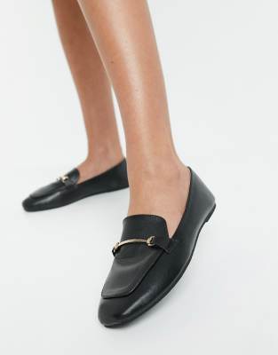 black shoes with gold trim