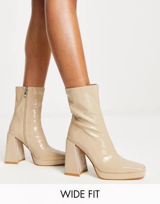  Vista heeled sock boots in ecru vinyl