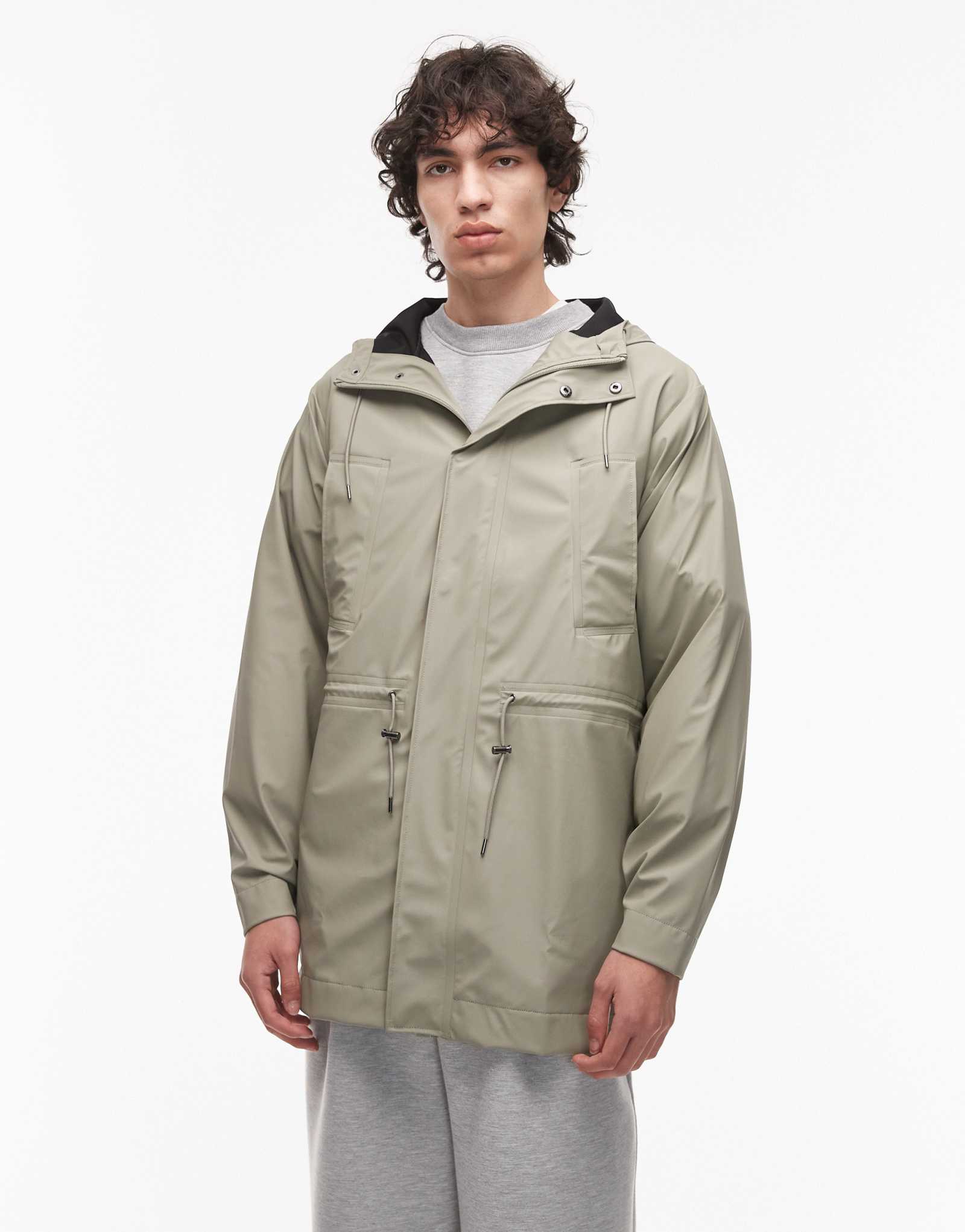 Непромокаемая длинная куртка Rains 12010 на молнии бледно-зеленого цвета