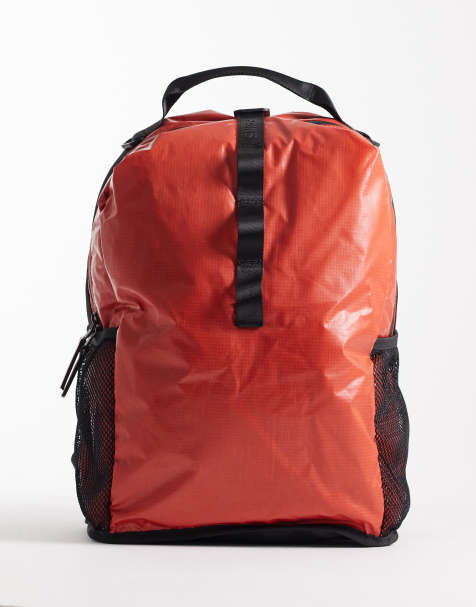 Rains 14680 Sibu waterproof grid print clip front backpack in red - view 1