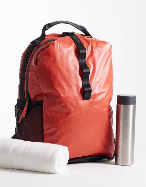 Rains 14680 Sibu waterproof grid print clip front backpack in red, 2 of 5
