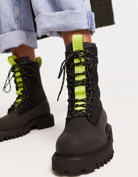 Rains combat lace up boots in black - view 1
