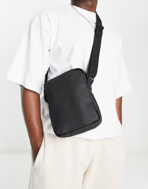 Rains cross body jet bag in black ASOS
