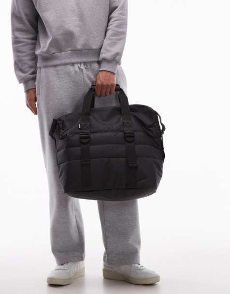 Rains – Kleine, wattierte Weekender-Tasche in Schwarz - view 1