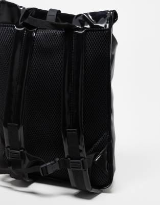 rains backpack shiny black Micro W3 making it ideal for daily commutes or travel Rains Bucket Rubberised Backpack -
