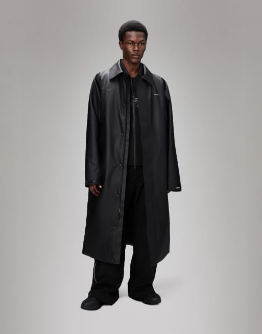 Rains X Umbro Manager waterproof trench coat in black | ASOS