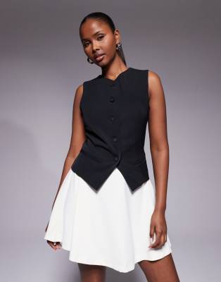 Rare London - Minikleid in Schwarz und Weiß mit kontrastierendem Rock und Westen-Detail