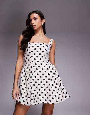 London - Robe courte plissée sur les côtés avec encolure carrée et laçage dans le dos - Blanc à pois-Multicolore 36