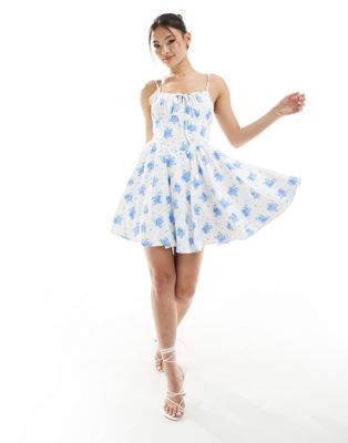 Rare London tie detail milkmaid skatter mini dress in white and blue floral