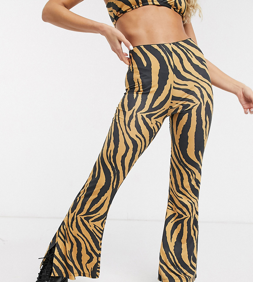 фото Расклешенные брюки с тигровым принтом reclaimed vintage-мульти