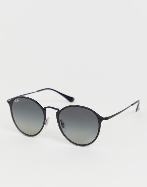 Ray Ban 0RB3574N round sunglasses in black