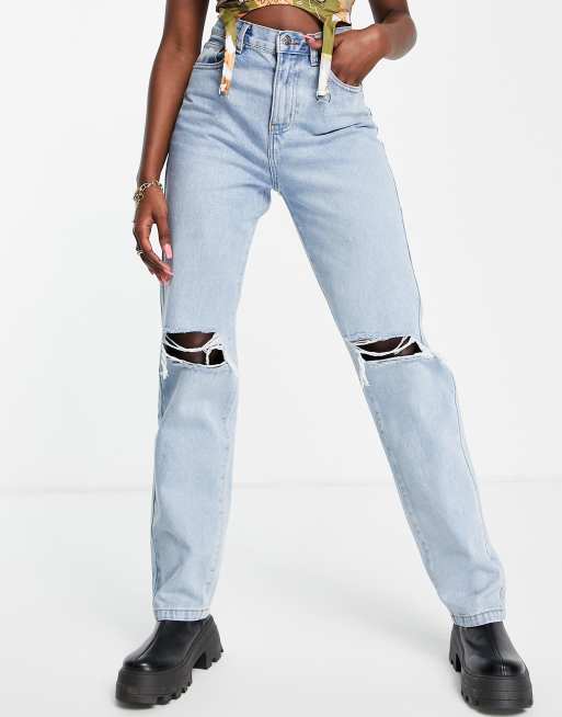 Rebellious Fashion denim distressed knee long jeans in mid wash |