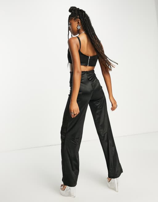 Rebellious Fashion drop shoulder fitted jumpsuit in black