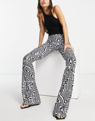 Rebellious Fashion flared trousers in swirl print | ASOS
