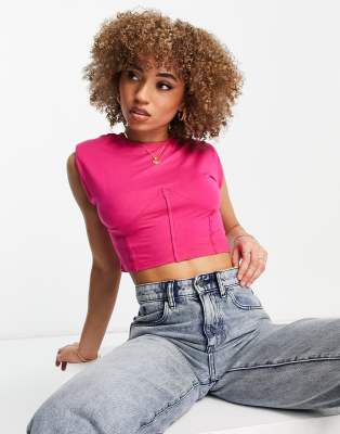 Rebellious Fashion front seam shoulder pad crop top in pink