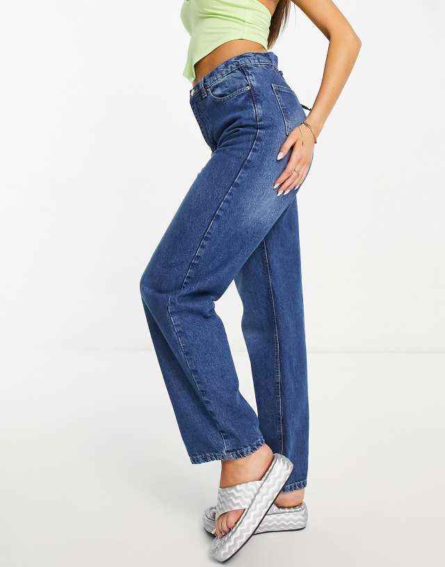 Rebellious Fashion high waist jeans with lace-up back in vintage blue
